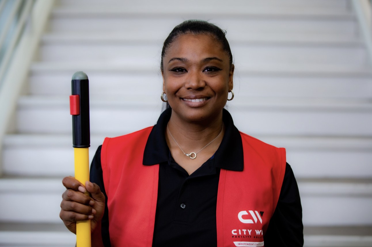 City Wide independent contractor smiling in a commercial building